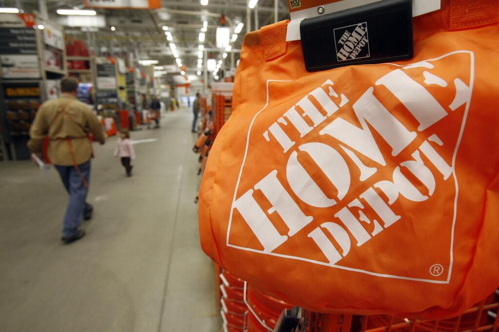 In this Feb. 22, 2010 file photo, shoppers walk through the aisles at the Home Depot store in Williston, Vt. (AP Photo/Toby Talbot, File)