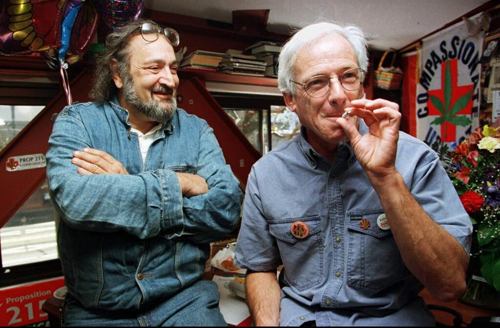 FILE - In this Nov. 6, 1996 file photo, Dennis Peron, leader of the campaign for Proposition 215 and founder of the Cannabis Buyers Club, right, smokes a marijuana cigarette next to Jack Herer, of Los Angeles, in San Francisco. Peron, an activist who was among the first people to argue for the benefits of marijuana for AIDS patients and helped legalize medical pot in California, died Saturday, Jan. 27, 2018, at 72. Peron was a driving force behind a San Francisco ordinance allowing medical marijuana ‚Äî a move that later aided the 1996 passage of Proposition 215 that legalized medical use in the entire state. (AP Photo/Andy Kuno, File)