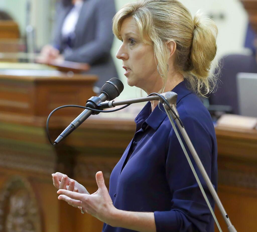 FILE - In this June 17, 2019, file photo, Assemblywoman Christy Smith, D-Santa Clarita, speaks in a session of the California Assembly in Sacramento, Calif. Smith is a candidate for the 25th Congressional District seat in the upcoming California Primary election. An ex-congressman, a state lawmaker, an online news personality and a former combat pilot are among the candidates hoping to fill a U.S. House seat north of Los Angeles - a race that's being watched nationally for hints about which party might control Congress next year. (AP Photo/Rich Pedroncelli, File)