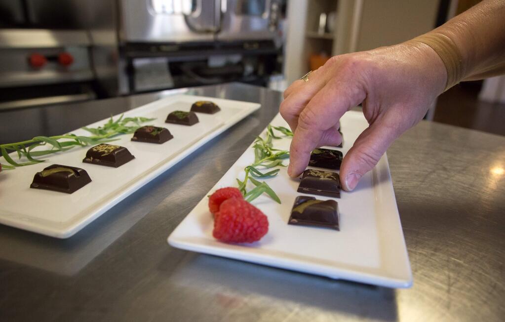 Carol Chapman, wine educator for Paradise Ridge Winery, prepares a dish of herb and fruit infused chocolate ahead of a Valentines day wine & chocolate pairing at Paradise Ridge Winery, in Santa Rosa, Calif Tuesday, February 14, 2017. (Jeremy Portje / For The Press Democrat)