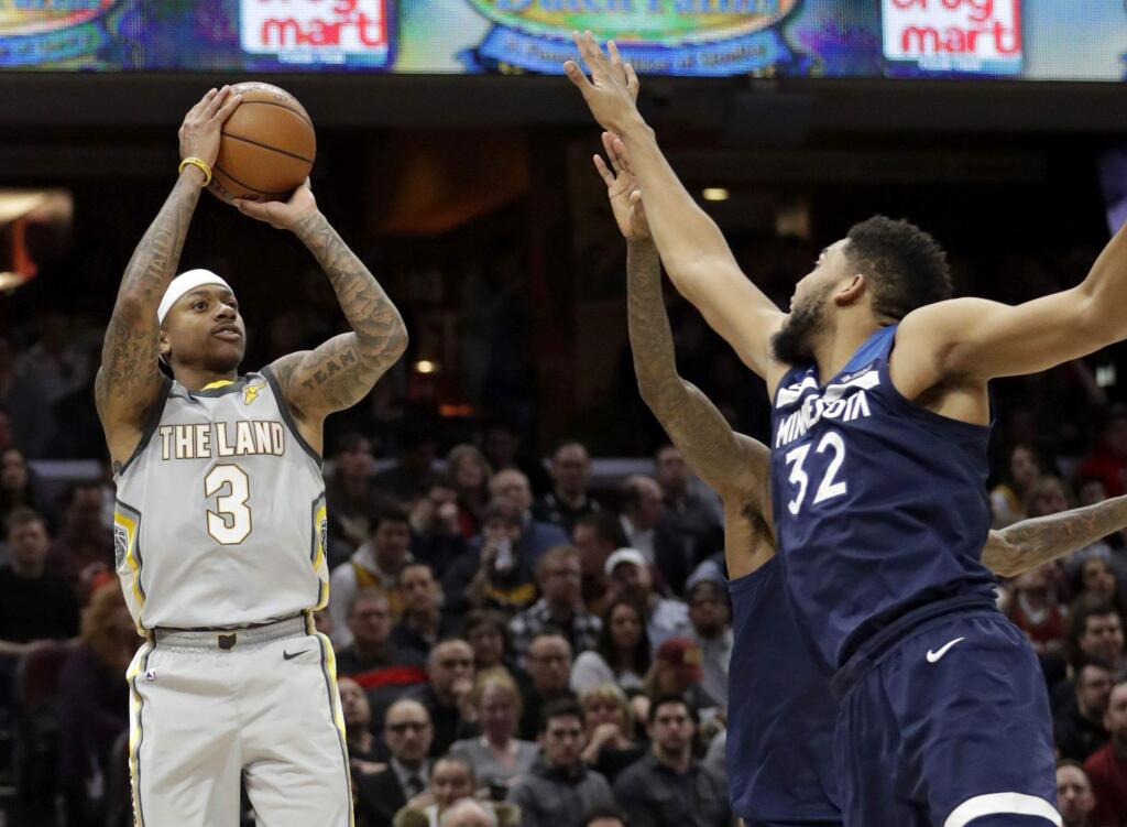 The Cleveland Cavaliers' Isaiah Thomas, left, shoots against the Minnesota Timberwolves in the first half Wednesday, Feb. 7, 2018, in Cleveland. (AP Photo/Tony Dejak)