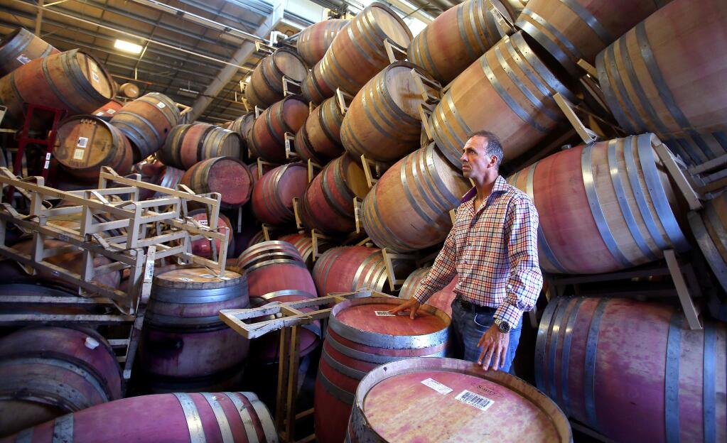 Rene Schlatter, proprietor of Starmont Winery, doesn't know how much of the three thousand full barrels of wine have been lost in the three barrel rooms following the earthquake in Napa. (Christopher Chung / The Press Democrat)