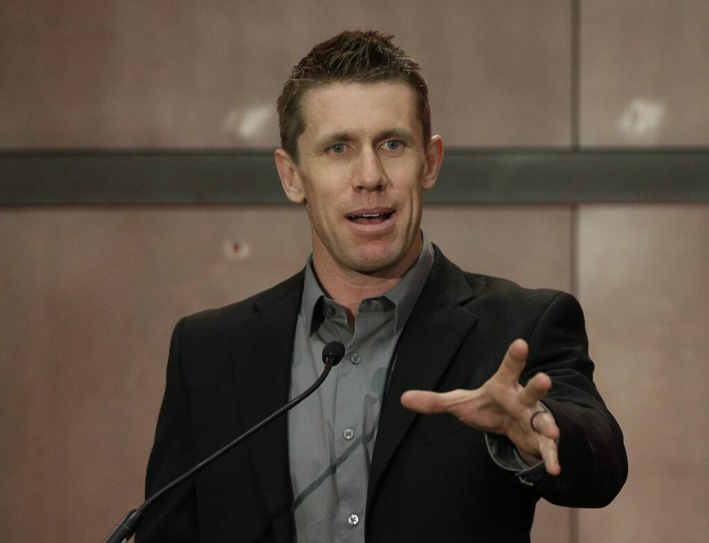 Carl Edwards speaks to the media during a news conference at Joe Gibbs Racing in Huntersville, N.C., Wednesday, Jan. 11, 2017. Edwards announced he was stepping away from racing. (AP Photo/Chuck Burton)