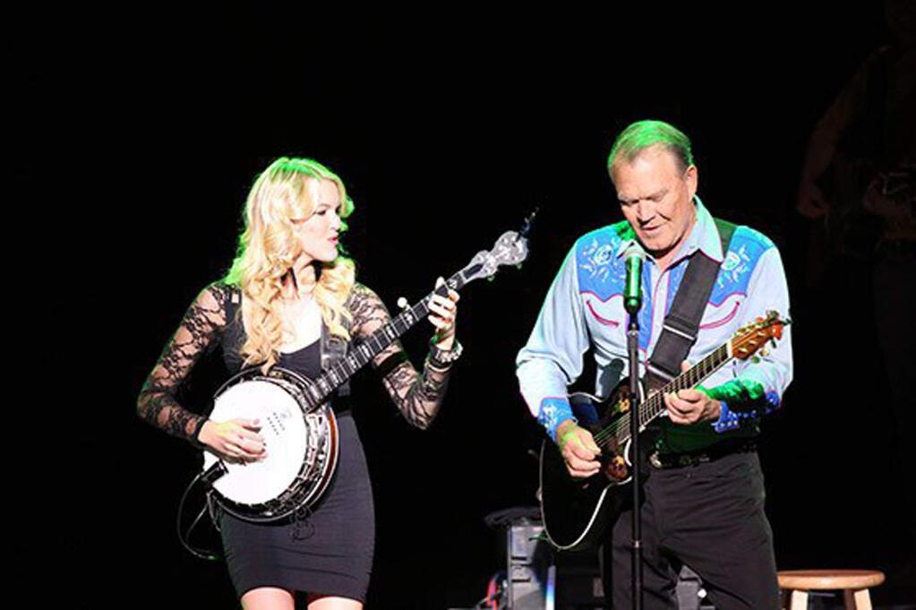 Glen Campbell, famous as a singer and entertainer during the 1960s, was also a legendary session musician. He is showing performing with daughter Ashley in a scene from the documentary, 'I'll Be Me.' (PCH FILMS)