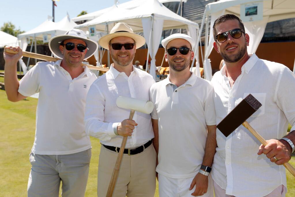 Tony Bartsch, left, Peter Lundy, Derek Drish, and Chris Conrad attend Wishes in Wine Country, a fundraiser for Make-A-Wish Greater Bay Area, at Sonoma-Cutrer Vineyards in Windsor, California on Saturday, May 20, 2017. (Alvin Jornada / The Press Democrat)