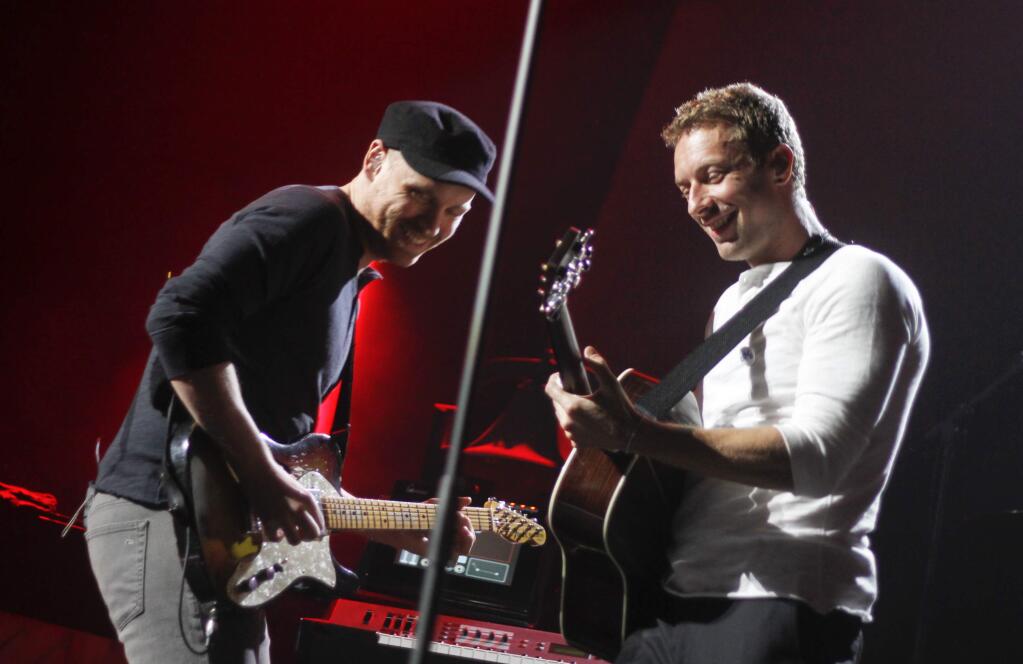 Coldplay (above), Taylor Swift, and One Direction are part of the star-studded lineup for this year's iHeartRadio Music Festival, Clear Channel announced Wednesday, July 23, 2014. (Photo by Jack Plunkett/Invision/AP, File 2011)