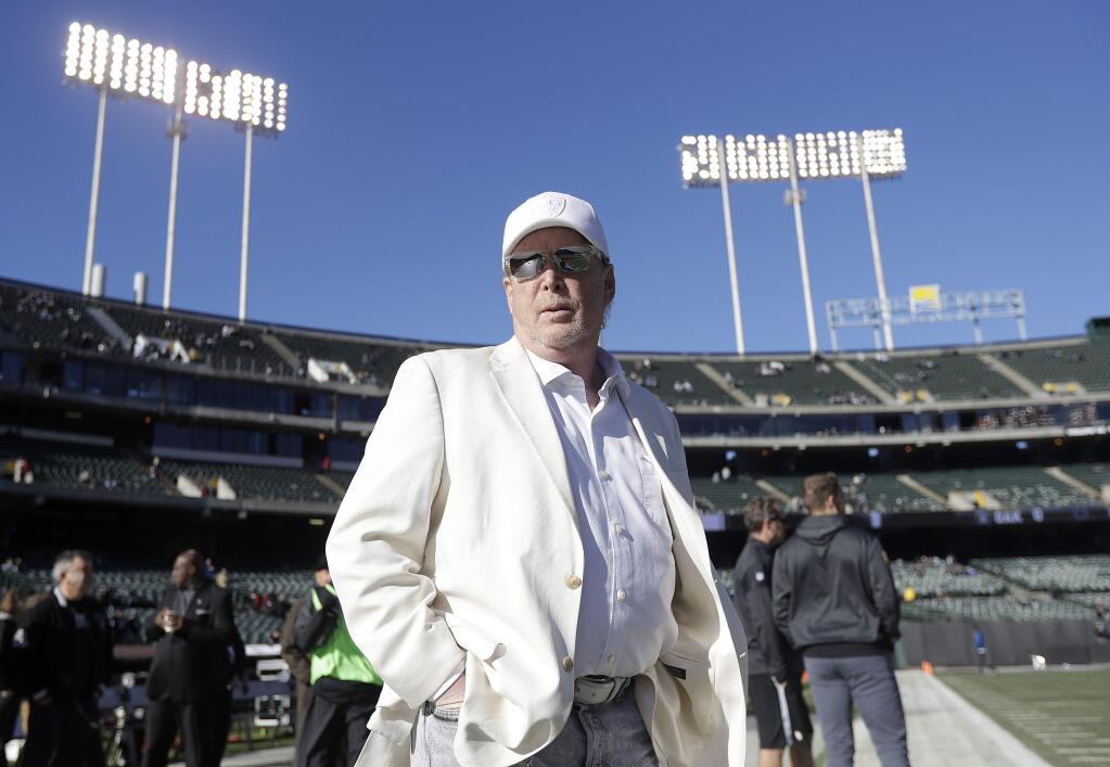 FILE - In this Dec. 24, 2016, file photo, Oakland Raiders owner Mark Davis waits for the team's NFL football game against the Indianapolis Colts in Oakland, Calif. (AP Photo/Marcio Jose Sanchez, File)
