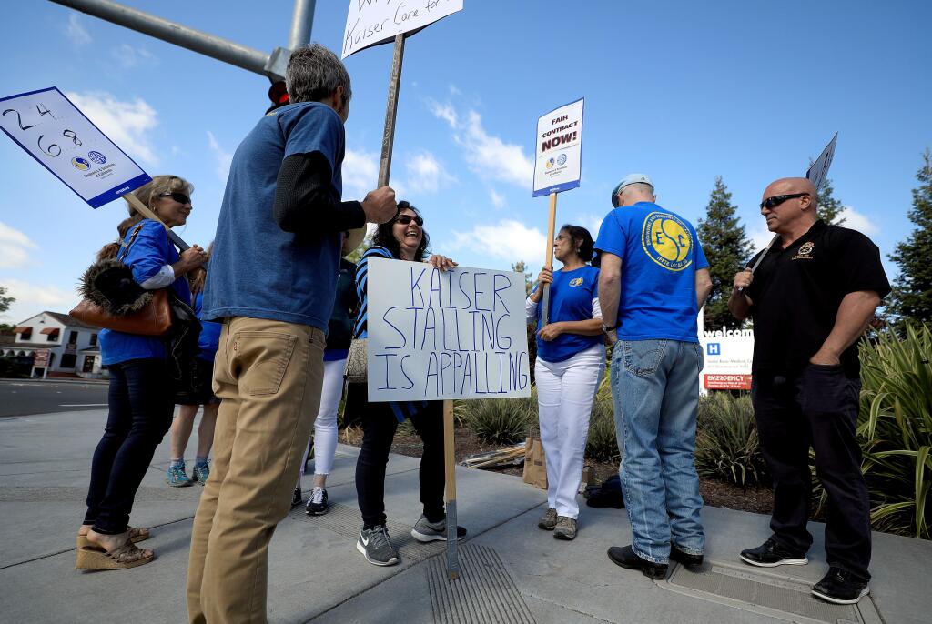 Kaiser home health occupational, physical and speech therapists picketed at the campus of Kaiser Permanente in Santa Rosa, Tuesday, April 30, 2019. (Kent Porter / The Press Democrat) 2019