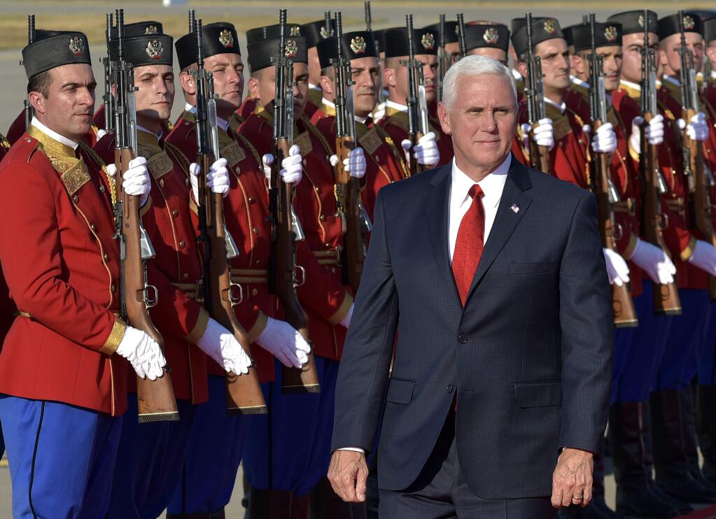 In this Aug. 1, 2017, photo, U.S. Vice President Mike Pence attends a welcome ceremony at Golubovci airport, near Podgorica, Montenegro. Pence has been a loyal messenger for President Donald Trump. At the same time, he has been carving out his own political identity as the steady understudy to a mercurial president. (AP Photo/Risto Bozovic, File)
