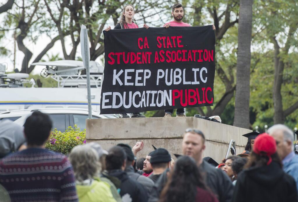 Students and supporters protest outside of the California State University Office of the Chancellor as the CSU Trustees finance committee vote on a tuition increase on a 7 to 2 vote in Long Beach Wednesday, March 22, 2017. (Thomas R. Cordova/Los Angeles Daily News via AP)
