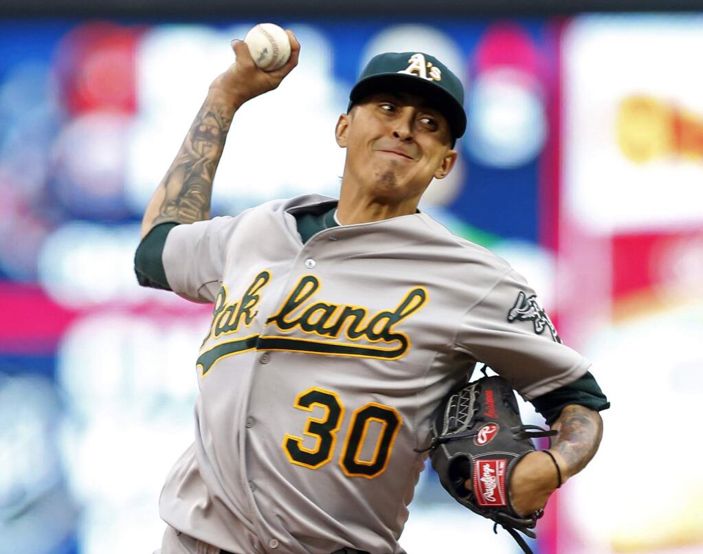 Oakland Athletics pitcher Jesse Chavez throws against the Minnesota Twins in the first inning of a game, Tuesday, May 5, 2015, in Minneapolis. (AP Photo/Jim Mone)