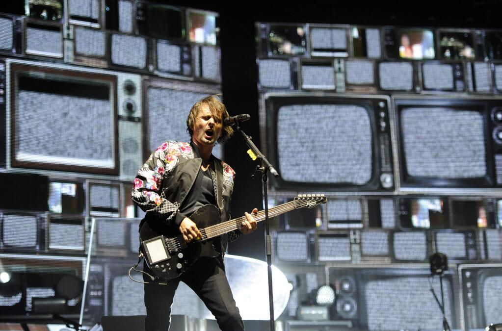 Matt Bellamy of Muse performs during the band's headlining set on day two of the 2014 Coachella Music and Arts Festival on Saturday, April 12, 2014, in Indio, Calif. (Photo by Chris Pizzello/Invision/AP)