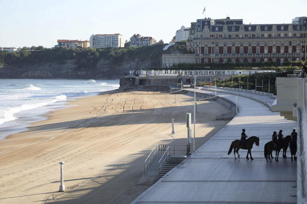 Mounted police officers patrol near the beach on the first day of the G-7 summit in Biarritz, France Saturday, Aug. 24, 2019. U.S. President Donald Trump and the six other leaders of the Group of Seven nations will begin meeting Saturday for three days in the southwestern French resort town of Biarritz. France holds the 2019 presidency of the G-7, which also includes Britain, Canada, Germany, Italy and Japan. (AP Photo/Markus Schreiber)