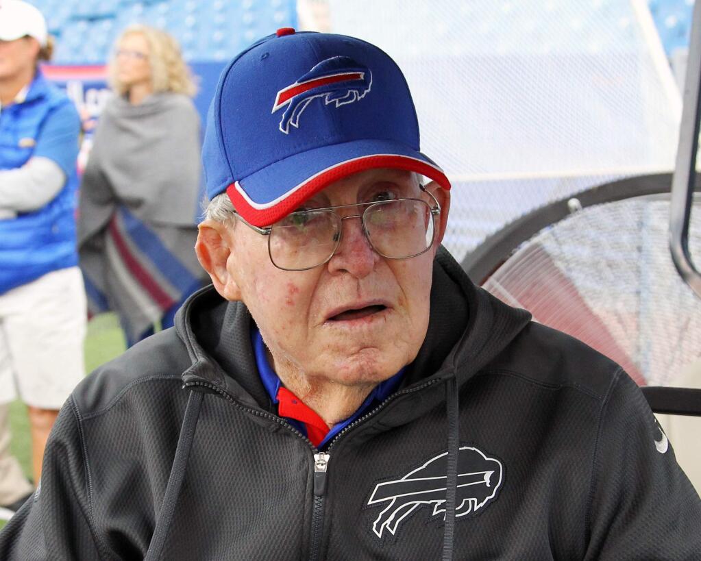 FILE - In this Sept. 13, 2015, file photo, former NFL coach Buddy Ryan watches from the sidelines before an NFL football game between the Buffalo Bills and Indianapolis Colts in Orchard Park, N.Y. Buddy Ryan, who coached two defenses that won Super Bowl titles and whose twin sons Rex and Rob have been successful NFL coaches, died Tuesday, June 28, 2016. He was 82. (AP Photo/Bill Wippert, FIle)