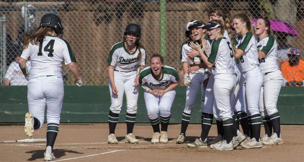 Annie Neles (14) trots home after her fourth-inning home run against Vintage, and is greeted by her enthusiastic teammates. The round-tripper gave Sonoma a 2-0 lead, but Vintage came back with three of their own to win, 5-3. (Photo by Robbi Pengelly/Index-Tribune)