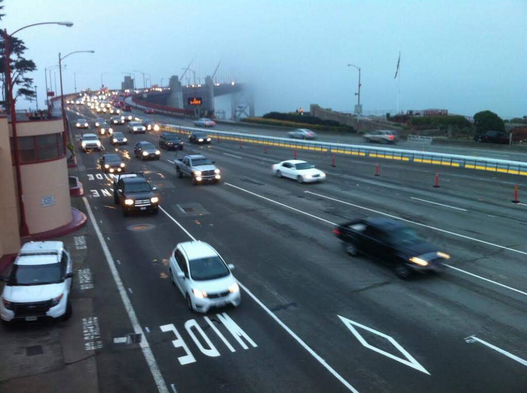 Traffic flows on the Golden Gate Bridge on Monday, Jan. 12, 2015. The bridge was reopened Sunday night after a weekend closure to install a safety barrier. (BETH SCHLANKER/ PD)