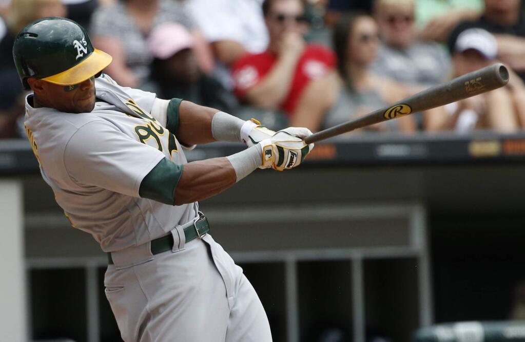 In this Sunday, June 25, 2017 file photo, the Oakland Athletics' Khris Davis hits an RBI-single against the Chicago White Sox during the eighth inning in Chicago. (AP Photo/Nam Y. Huh, File)