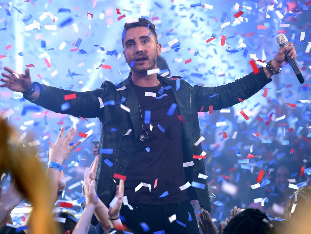 Nick Fradiani reacts after he is announced as the winner at the American Idol XIV finale at the Dolby Theatre on Wednesday, May 13, 2015, in Los Angeles. (Photo by Chris Pizzello/Invision/AP)