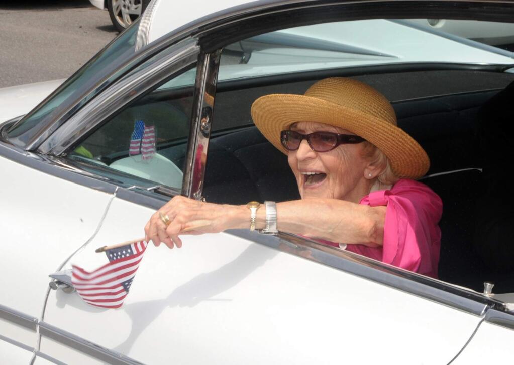 In this June 30, 2012 file photo, parade grand marshall actress Ellen Albertini Dow waves to the crowd as she rides in the back of a classic car during the Six-County Firemen's Parade in Mount Carmel, Northumberland County. Dow, a feisty and fiercely independent character actor best known for her salty rendition of ìRapperís Delightî in ìThe Wedding Singer,î died Monday, May 4, 2015, according to her agent Juliet Green. She was 101. (Mike Staugaitis/The News-Item via AP, File)