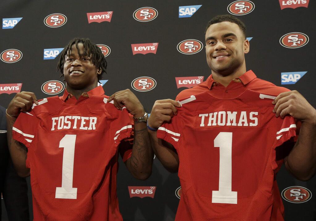 San Francisco 49ers draft picks Reuben Foster, left, and Solomon Thomas pose for photos at a news conference in Santa Clara, Calif., Friday, April 28, 2017. (AP Photo/Jeff Chiu)