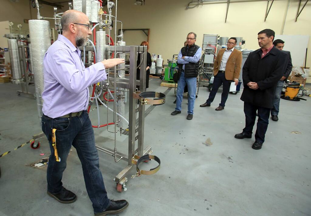 Greg Galardy of CBD Guild explains how C02 fluid extraction machines produce cannabis concentrates in Santa Rosa on Wednesday, Dec. 14, 2016. (KENT PORTER/ PD)