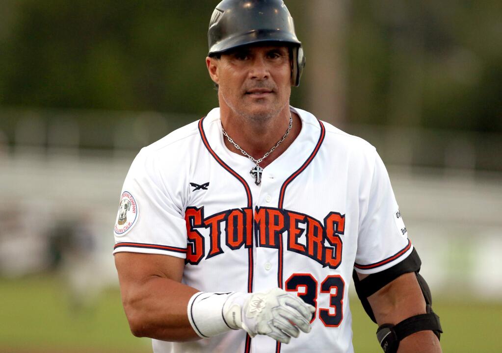 Jose Canseco, former big-league baseball star, was designated hitter for the Sonoma Stompers when they faced off against the San Rafael Pacifics at Arnold Field in Sonoma, Friday, June 12, 2015. (Crista Jeremiason / The Press Democrat)