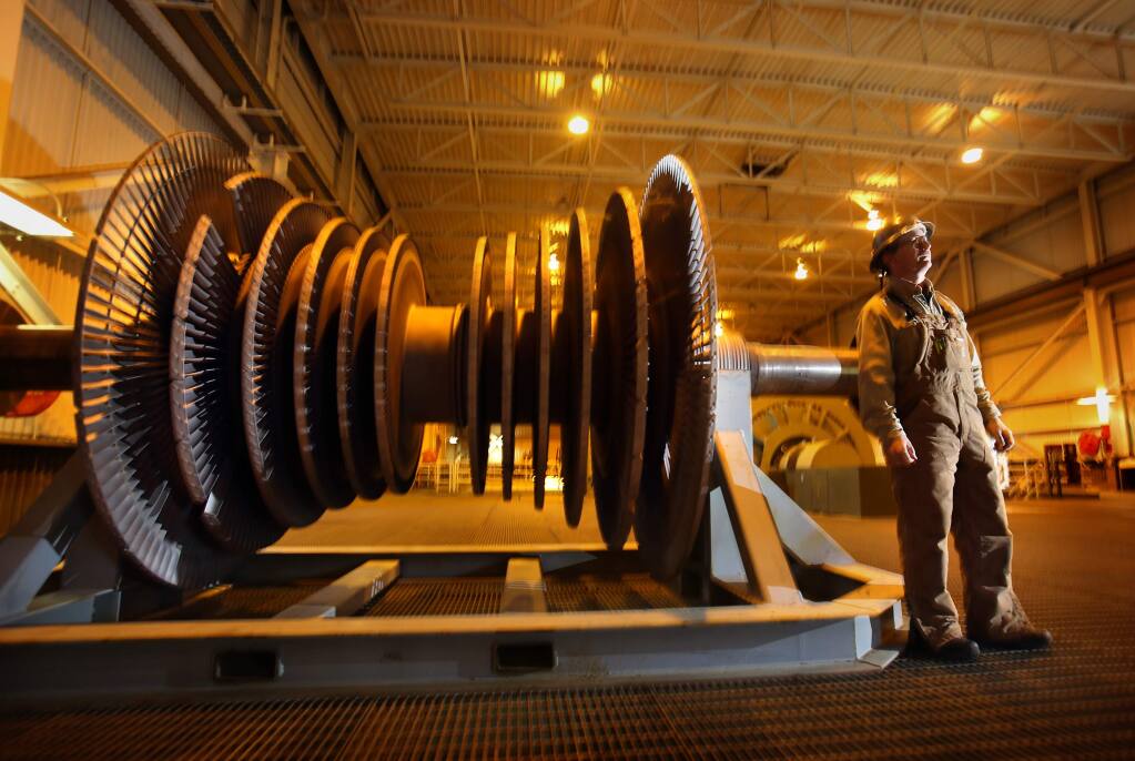 (FILE PHOTO) An operator stands next to a steam turbine used to produce power at the Calpine facility in The Geysers. The City of Healdsburg has become the second city in Sonoma County to operate on 100 percent renewable power. It gets most of its power from The Geysers. (John Burgess/The Press Democrat)