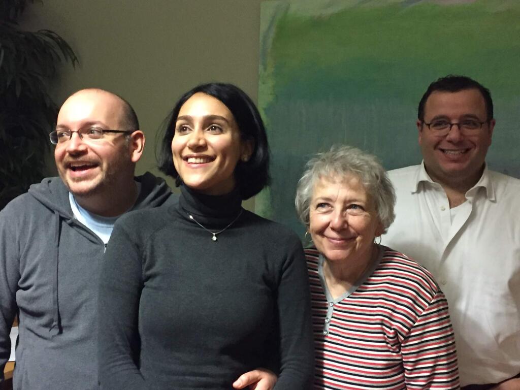 Jason Rezaian, his wife, Yeganeh Salehi, his mother, Mary Rezaian, and brother Ali Rezaian pose for a photo Monday at Landstuhl Regional Medical in Germany. Rezaian was freed Saturday after almost 18 months of incarceration in an Iranian prison. (MARTIN BARON / Washington Post)
