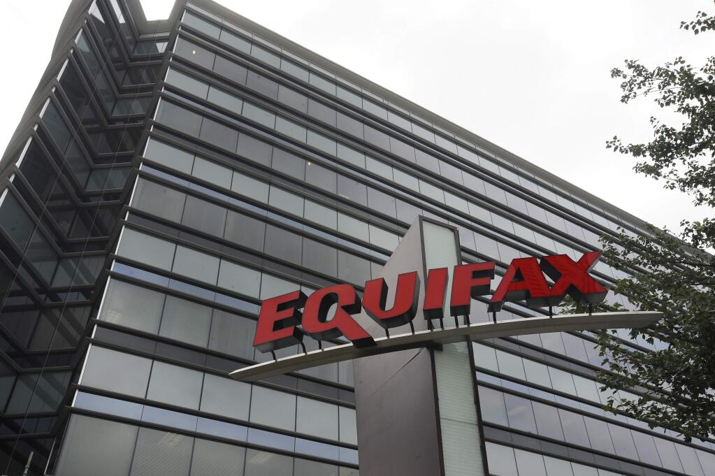 This July 21, 2012, photo shows Equifax Inc., offices in Atlanta. Credit monitoring company Equifax says a breach exposed social security numbers and other data from about 143 million Americans. The Atlanta-based company said Thursday, Sept. 7, 2017, that 'criminals' exploited a U.S. website application to access files between mid-May and July of this year. (AP Photo/Mike Stewart)