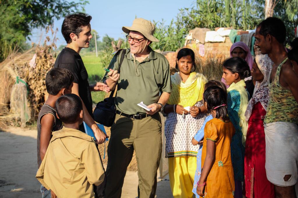 Austin Meyer and Nicholas Kristof interview villagers in Azin Nagar, a village in Uttar Pradesh, India. (Courtesy photo)
