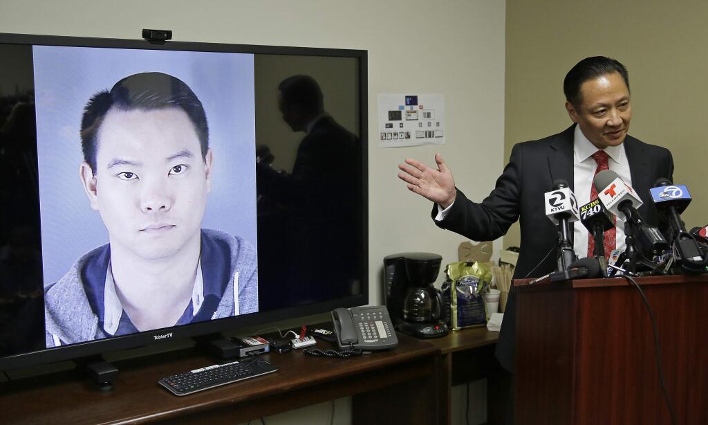 FILE - In this Tuesday, April 26, 2016 file photo, San Francisco Public Defender Jeff Adachi gestures while standing beside a picture of police officer Jason Lai during a news conference in San Francisco. San Franciscos police chief has ordered effective immediately that every sworn officer attend an anti-harassment class while he released more transcripts of a former lieutenant and two former officers exchanging racist text messages. Investigators found the text messages on the personal phones of during criminal probes of former officer Jason Lai and retired Lt. Curtis Liu. (AP Photo/Eric Risberg, File)