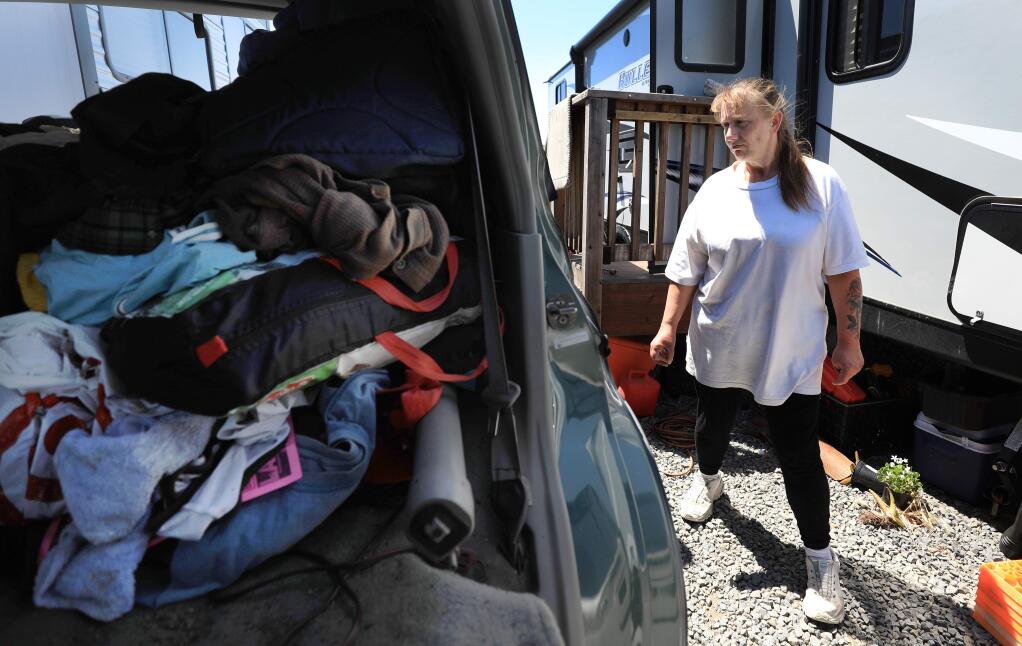 Pam Peavler and boyfriend Scott Struckman (not pictured) are vacating from their FEMA trailer, right, and packing to leave the Sonoma County Fairgrounds RV Park, Friday, May 10, 2019 in Santa Rosa. (Kent Porter / The Press Democrat) 2019