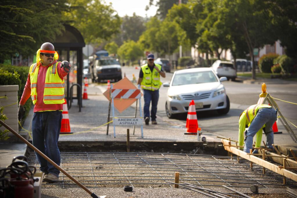 Petaluma begins repairs on its city streets. A crew works on the pavement of 4th Street between B & C. (CRISSY PASCUAL/ARGUS-COURIER STAFF)