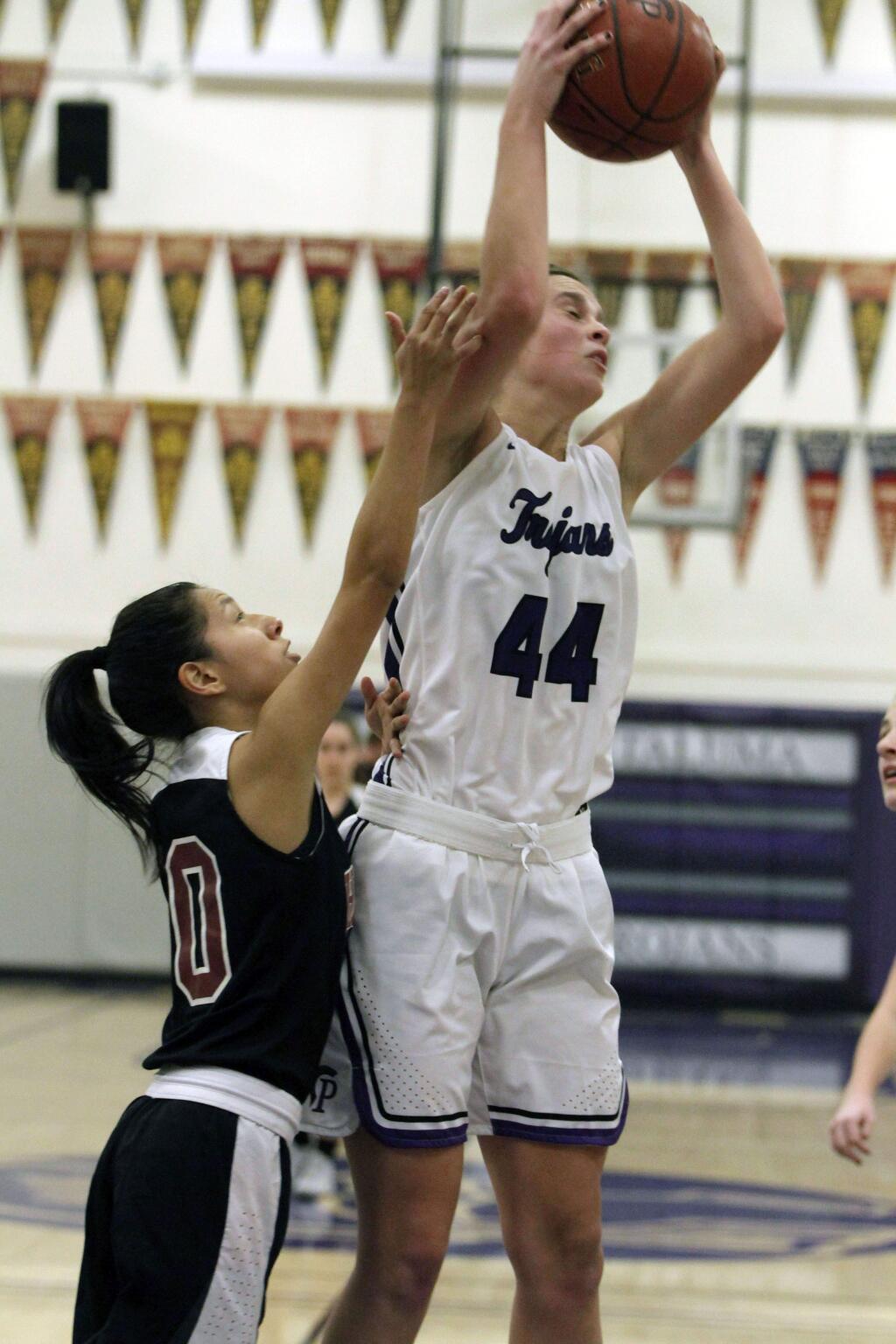 DWIGHT SUGIOKA/FOR THE ARGUS-COURIERJaden Krist soars high to snare a rebound in Petaluma's 43-29 win over Healdsburg.