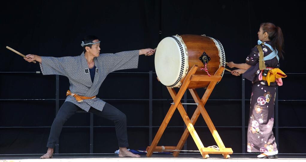 Hideaki Nishikura, left, and Hitomi Kimura performed the Hachijo Daiko Opening during the Matsuri Japanese Arts Festival held at Juilliard Park Saturday, May 2, 2015. (CRISTA JEREMIASON / PD)
