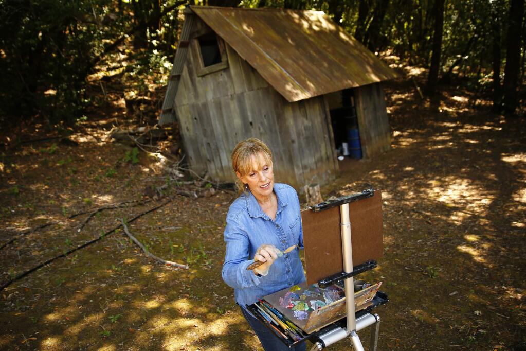 Painter Linda Barretta pains from her studio and home in Healdsburg on Thursday, June 26, 2014. (Conner Jay/The Press Democrat)