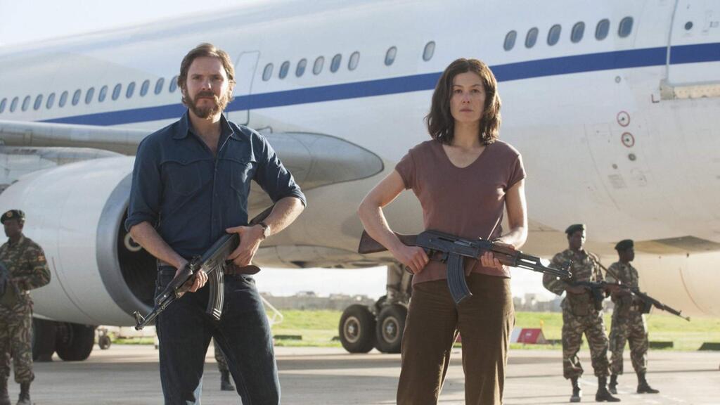 Daniel Brühl as Wilfried Böse and Rosamund Pike as Brigitte Kuhlmann in '7 Days in Entebbe,' the story of 1976 hijacking of an Air France plane with 248 passengers by two members of the Popular Front for the Liberation of Palestine. (Participant Media)