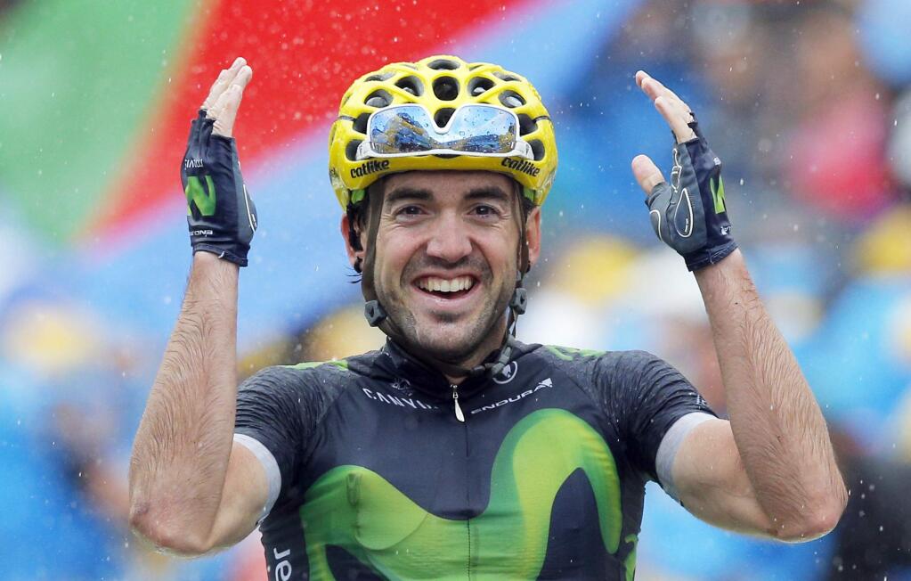 Spainís Jon Izaguirre Insausti celebrates as he crosses the finish line to win the twentieth stage of the Tour de France cycling race over 146.5 kilometers (90.7 miles) with start in Megeve and finish in Morzine-Avoriaz, France, Saturday, July 23, 2016. (AP Photo/Christophe Ena)