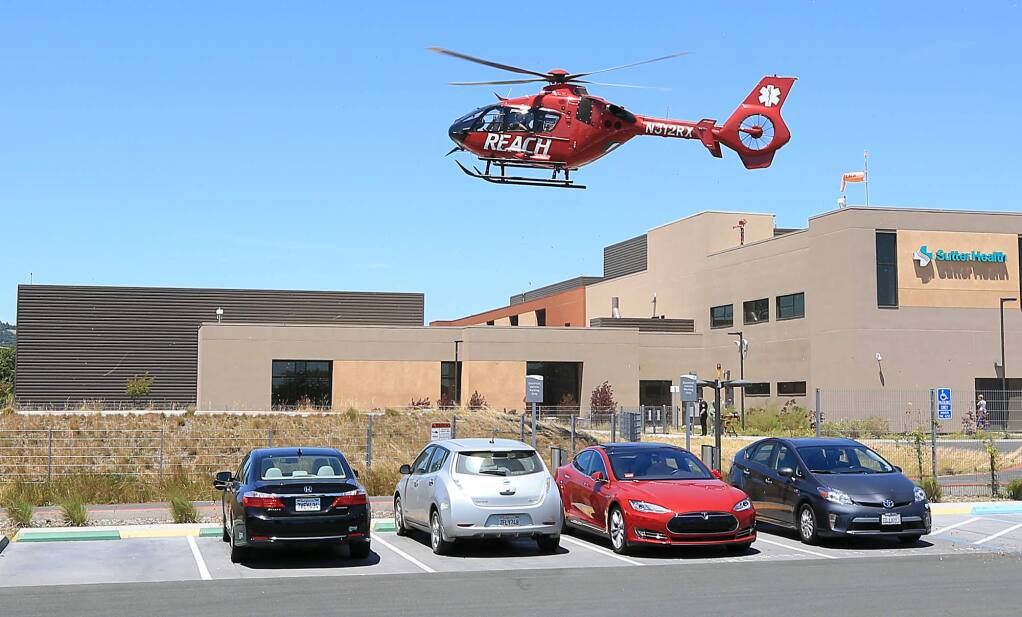 A REACH helicopter lands at Sutter Hospital with a patient from Sea Ranch, Wednesday June 14, 2017 in Santa Rosa. (Kent Porter / The Press Democrat) 2017