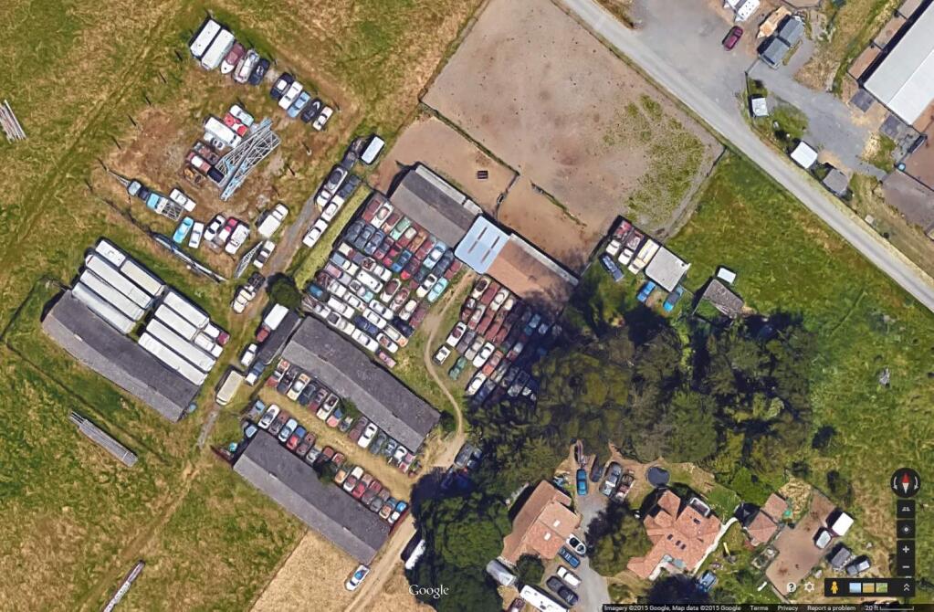 A Google Earth image shows a property at 50 Sonoma Mountain Road, where the County of Sonoma and a Petaluma-area family have been locked in a dispute over nonrunning cars.