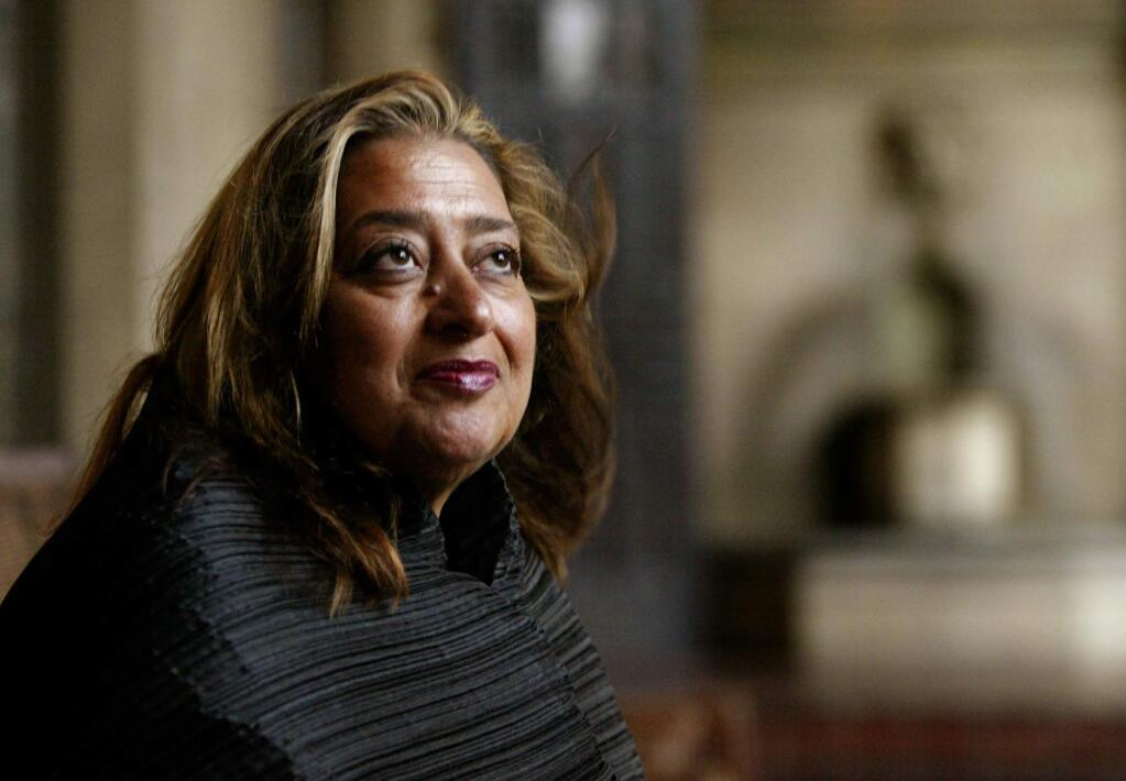 FILE- In this March 21, 2004 file picture, Iraqi-British architect Zaha Hadid poses in West Hollywood, Calif. Hadid, whose modernist, futuristic designs included the swooping aquatic center for the 2012 London Olympics, has died aged 65, Thursday, March 31, 2016. (AP Photo/Kevork Djansezian, File)
