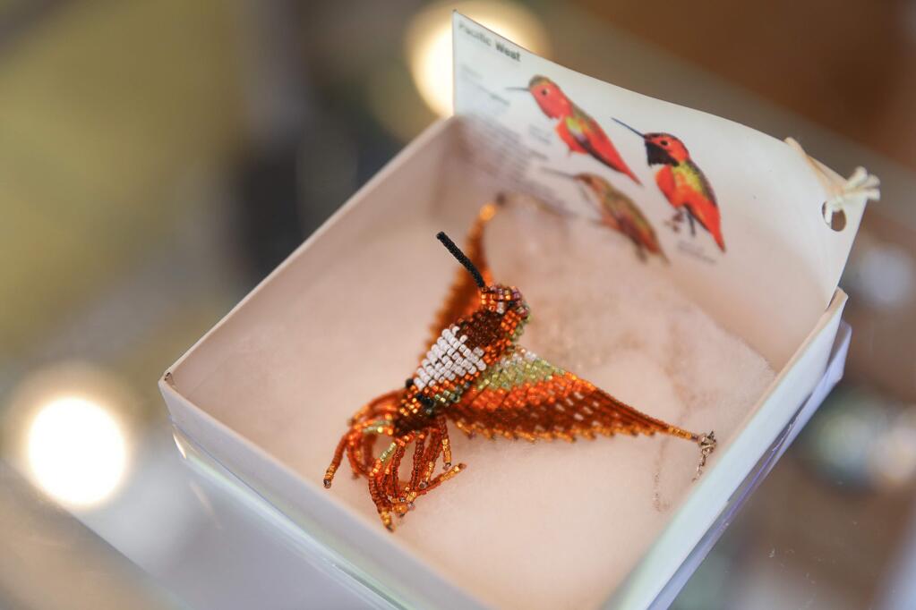 A beaded hummingbird pendant created by artist, and store volunteer, Christine Paschal at the Forest to the Sea Nature Store in Guerneville on Friday, August 23, 2019. The store is operated by the Stewards of the Coast and Redwoods. (Christopher Chung/ The Press Democrat)