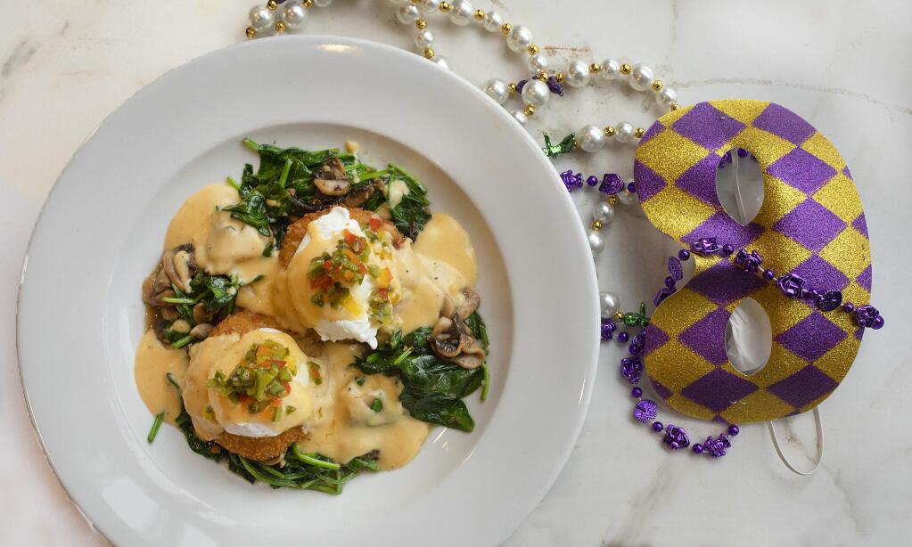 The Sunday Mimosa Brunch includes Cajun Bubble & Squeak withpotato cakes fried golden brown, poached eggs, garlic spinach, wild mushrooms with a jalapeño and jack cheese sauce from Gator's Rustic Burger & His Creole Friends in the Petaluma theater district. (photo by John Burgess/The Press Democrat)