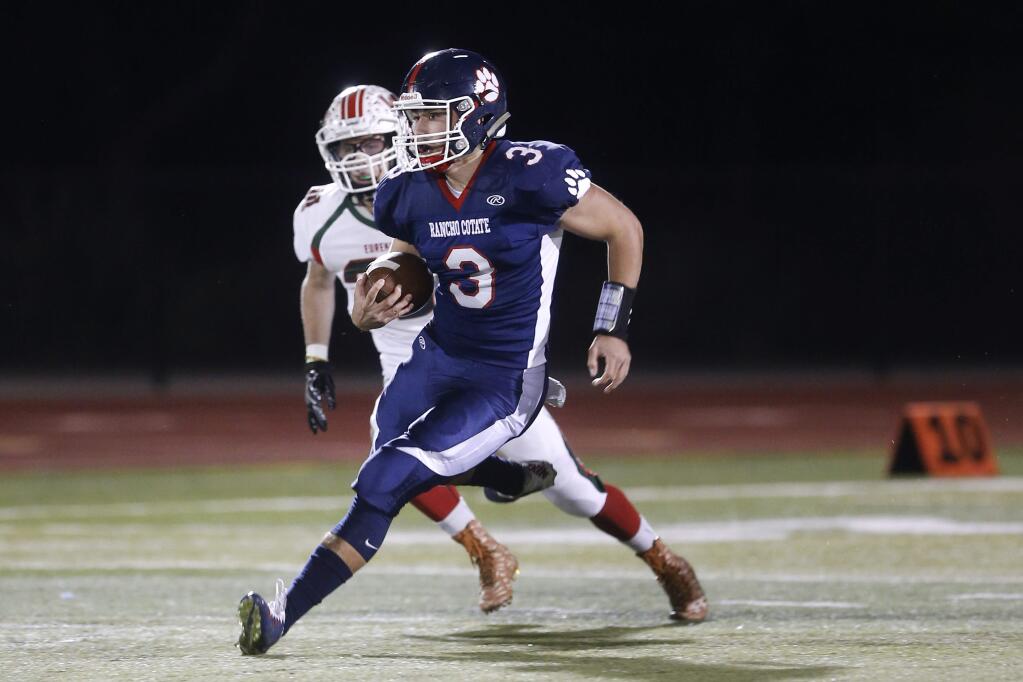 Rancho Cotate quarterback Jake Simmons runs with the ball versus Eureka during their NCS Division III quarterfinal game at Rancho Cotate High School on Friday, November 18, 2016 in Rohnert Park, California. (RAMIN RAHIMIAN for The Press Democrat)