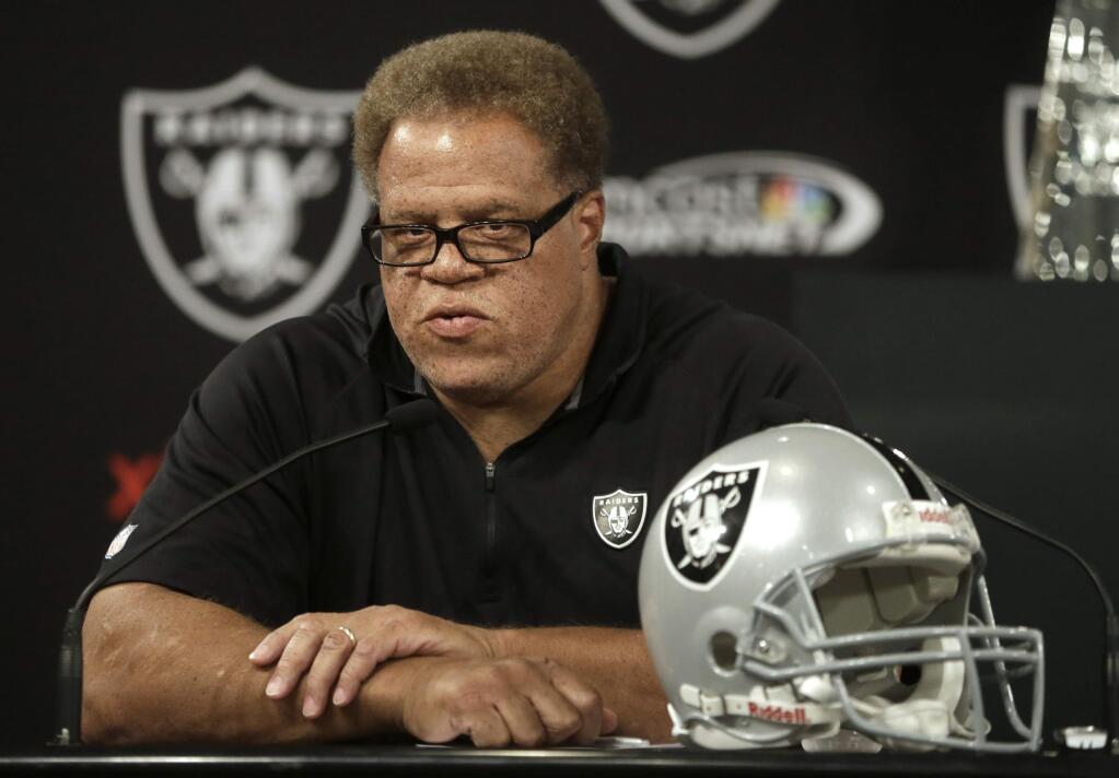 Oakland Raiders general manager Reggie McKenzie answers questions from reporters during a news conference Tuesday, Sept. 30, 2014, in Alameda, Calif. The Oakland Raiders named Tony Sparano as interim coach of the NFL football team, a day after the firing of coach Dennis Allen. (AP Photo/Ben Margot)