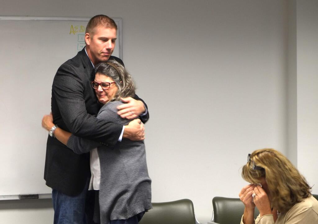Lynn King is reunited with Scott Pritchard, who performed CPR during her sudden cardiac arrest in August 2015. (ERIC GNECKOW/ARGUS-COURIER STAFF)