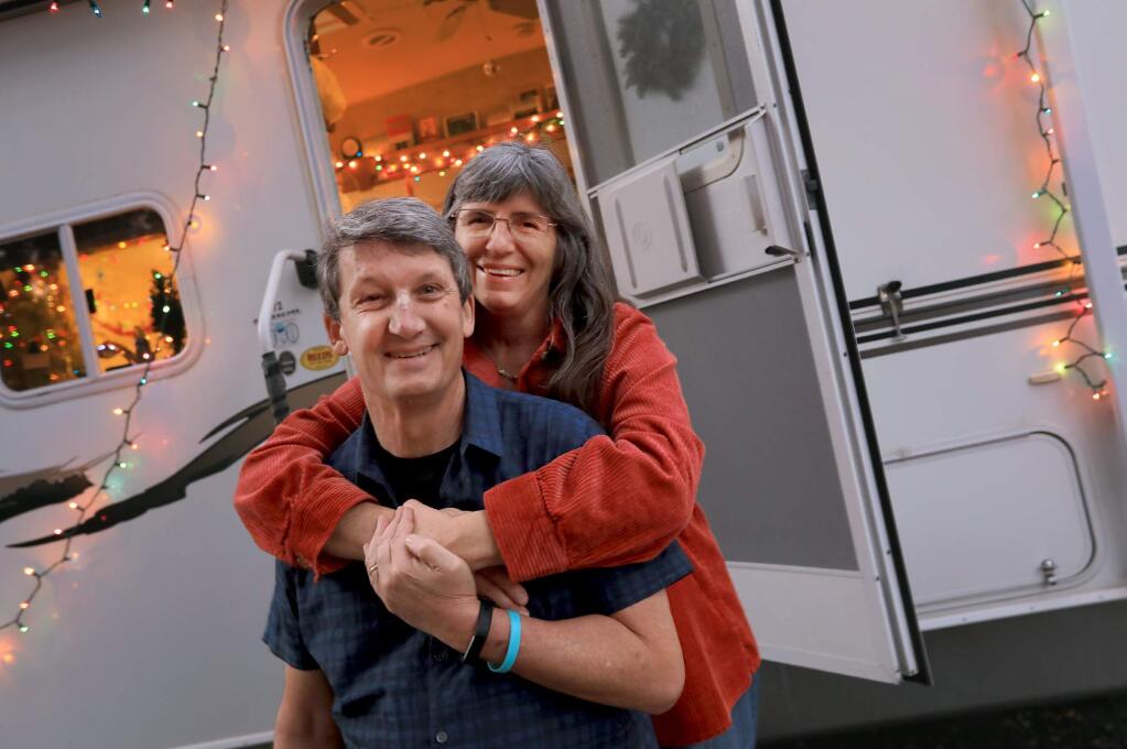 Jill and her husband Arthur Dawson in the trailer they call home after the Nuns fire in Glen Ellen took out their home in October. A neighbor of the Dawson family purchased a trailer for the couple to live in and a smaller one for their teenage son, Wednesday Jan. 10, 2018. (Kent Porter / Press Democrat) 2018