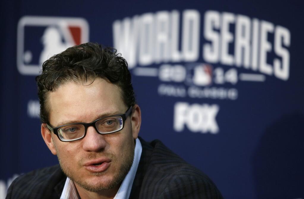 FILE - In this Oct. 27, 2014, file photo, San Francisco Giants pitcher Jake Peavy speaks during a news conference in Kansas City. A person familiar with the negotiations says pitcher Jake Peavy has agreed to a $24 million, two-year contract to stay with the World Series champion San Francisco Giants. The person spoke on condition of anonymity to The Associated Press on Friday, Dec. 19, 2014, because the agreement had not yet been announced. (AP Photo/Charlie Neibergall, File)