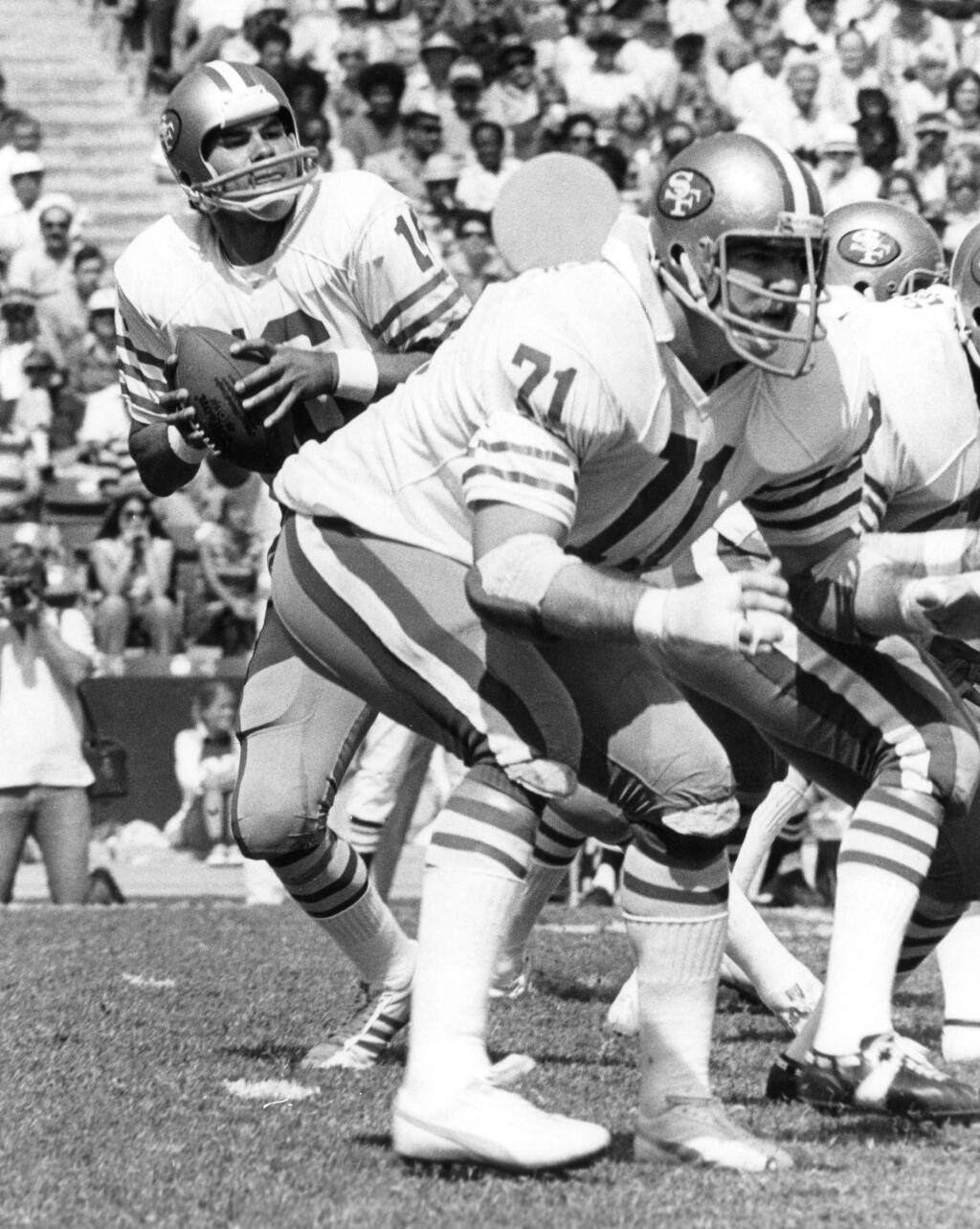 This Oct. 2, 1977, photo provided by the NFL shows San Francisco 49ers tackle Keith Fahnhorst (71) blocking for quarterback Jim Plunkett (16) as he drops back to pass against the Los Angeles Rams, at Los Angeles Memorial Coliseum. Former star San Francisco 49ers tackle Keith Fahnhorst has died at 66. The team said Friday he died Tuesday, June 12, 2018. No cause was given. (NFL Photos via AP)