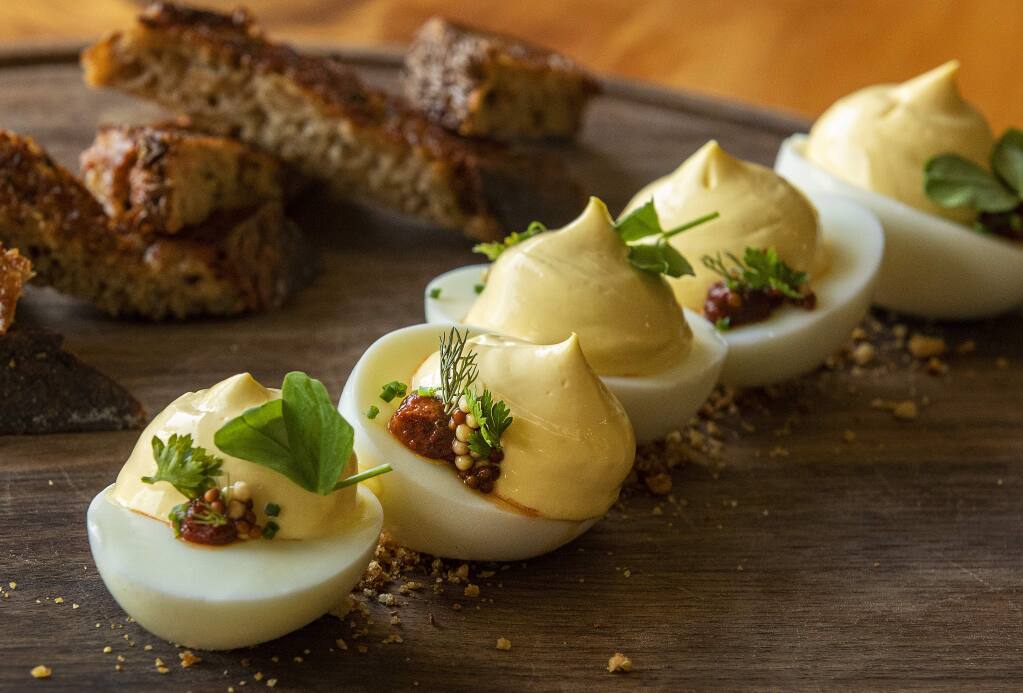 Classic deviled eggs with smoked harissa, picked mustard and garlic toast from the Valley Ford Cheese and Creamery on Highway 1 in Valley Ford. (John Burgess/The Press Democrat)